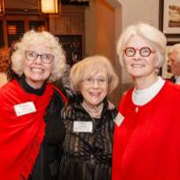 Three GVSU FIrst Ladies, Marcia Haas, Nancy Lubbers, and Elizabeth Murray, standing together and posing for camera